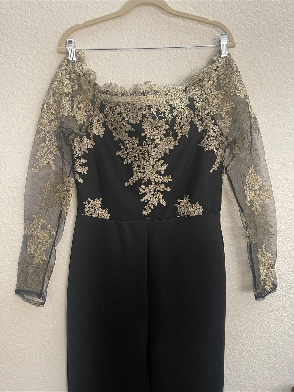 Elegant Black Dress with Gold Lace Accents